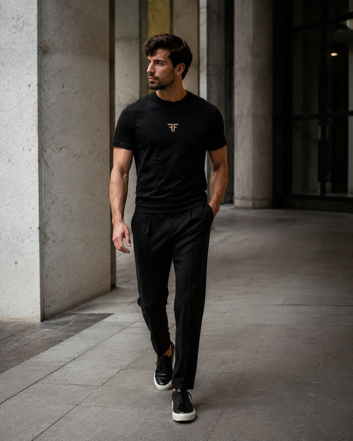 Faith Above Fear — black tee and tailored trousers on the street